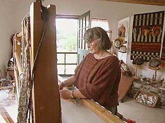 Photo of artist Susan Merrill in her weaving studio
